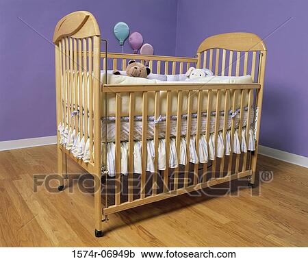 Stock Image - Baby's crib and toys. Fotosearch