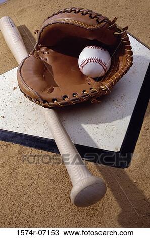 Baseball bat with a glove and a baseball on the home base View Large Photo Image Stock Image - Baseball bat with a glove and a baseball on the home base. Fotosearch