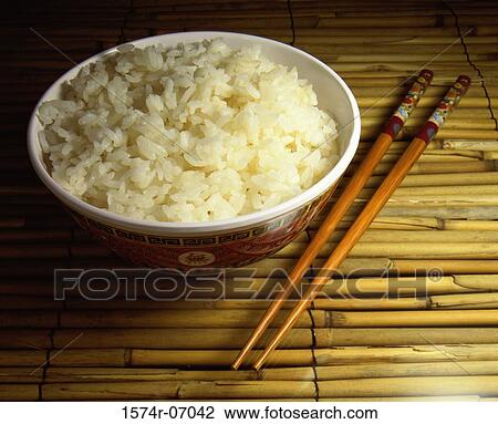 Bowl of rice with chopsticks View Large Photo Image Stock Image - Bowl of rice with chopsticks. Fotosearch