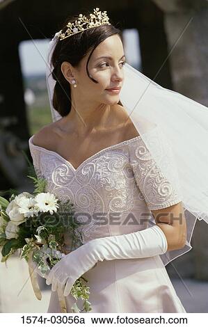 Bride holding a bouquet of flowers View Large Photo Image Stock Image - Bride holding a bouquet of flowers. Fotosearch