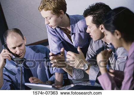 Business executives having a discussion View Large Photo Image Stock Image - Business executives having a discussion. Fotosearch