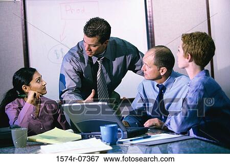 Business executives having a discussion View Large Photo Image Stock Photo - Business executives having a discussion. Fotosearch