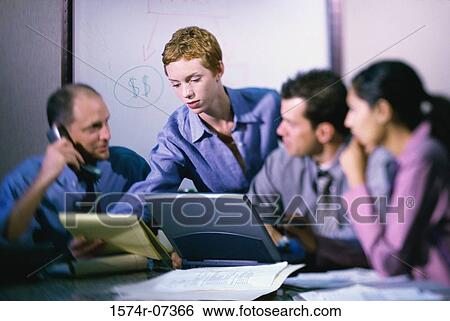 Business executives having a discussion View Large Photo Image Stock Photograph - Business executives having a discussion. Fotosearch