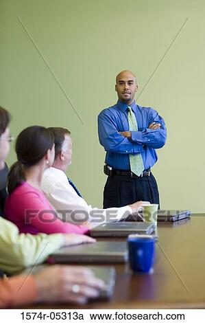 Business executives in a conference room View Large Photo Image Stock Image - Business executives in a conference room. Fotosearch