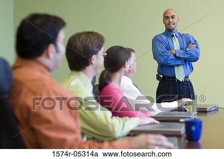 Business executives in a conference room View Large Photo Image Stock Image - Business executives in a conference room. Fotosearch