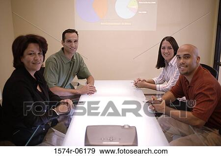 Stock Photo - Business executives in a conference room. Fotosearch