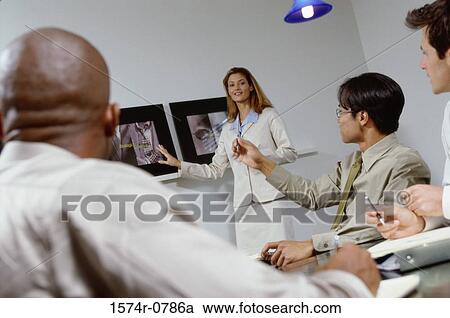Business executives in a meeting View Large Photo Image Stock Image - Business executives in a meeting. Fotosearch