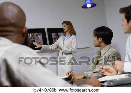Business executives in a meeting View Large Photo Image Stock Image - Business executives in a meeting. Fotosearch