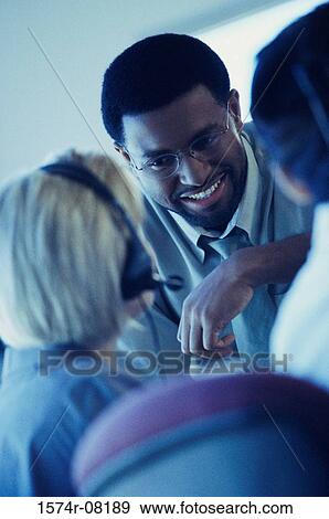 Business executives in an office View Large Photo Image Stock Photo - Business executives in an office. Fotosearch