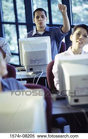 Business executives sitting in front of computer monitors View Large Photo Image Stock Photography - Business executives sitting in front of computer monitors. Fotosearch