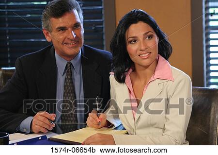 Businessman and a businesswoman in a conference room View Large Photo Image Stock Image - Businessman and a businesswoman in a conference room. Fotosearch