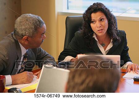 Businessman and a businesswoman in a conference room View Large Photo Image Stock Photo - Businessman and a businesswoman in a conference room. Fotosearch