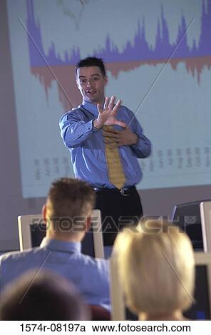 Businessman conducting a presentation View Large Photo Image Stock Image - Businessman conducting a presentation. Fotosearch