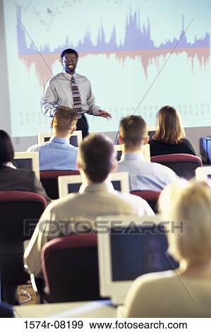 Businessman conducting a presentation View Large Photo Image Stock Photo - Businessman conducting a presentation. Fotosearch