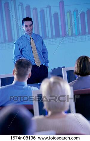 Businessman conducting a presentation View Large Photo Image Stock Photograph - Businessman conducting a presentation. Fotosearch