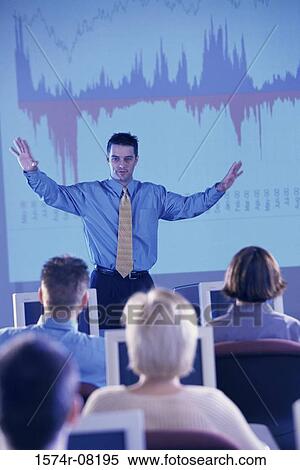 Businessman conducting a presentation View Large Photo Image Stock Photography - Businessman conducting a presentation. Fotosearch