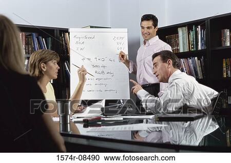 Businessman giving a presentation in an office View Large Photo Image Stock Image - Businessman giving a presentation in an office. Fotosearch