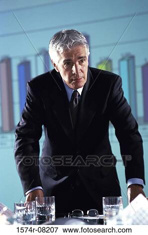 Stock Photo - Businessman giving a presentation in an office. Fotosearch