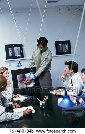 Businessman pointing to a computer monitor during a presentation View Large Photo Image Stock Image - Businessman pointing to a computer monitor during a presentation. Fotosearch