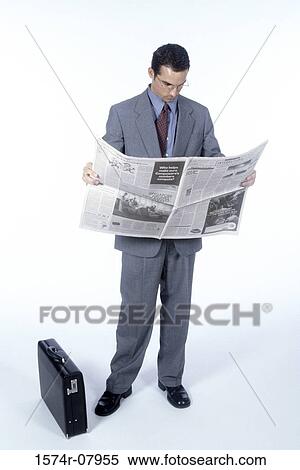 Businessman reading a newspaper View Large Photo Image Stock Photography - Businessman reading a newspaper. Fotosearch