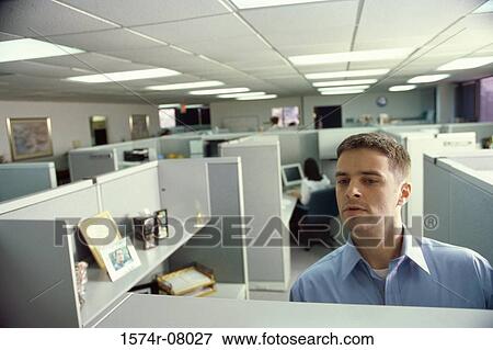 Businessman standing in an office View Large Photo Image Stock Photo - Businessman standing in an office. Fotosearch