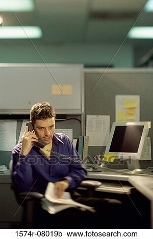 Stock Image - Businessman talking on a landline telephone. Fotosearch