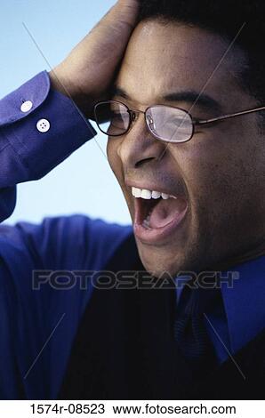 Businessman with a hand on his head View Large Photo Image Stock Image - Businessman with a hand on his head. Fotosearch