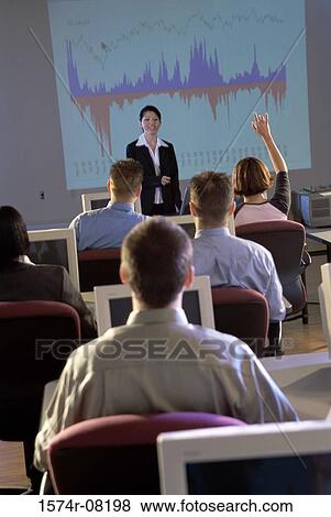 Businesswoman conducting a presentation View Large Photo Image Stock Photo - Businesswoman conducting a presentation. Fotosearch