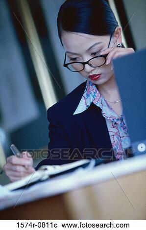 Businesswoman looking down View Large Photo Image Stock Image - Businesswoman looking down. Fotosearch