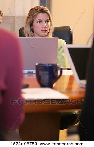 Businesswoman sitting in a conference room View Large Photo Image Stock Image - Businesswoman sitting in a conference room. Fotosearch