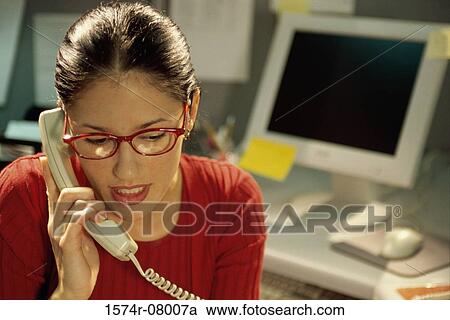 Stock Image - Businesswoman talking on a telephone. Fotosearch