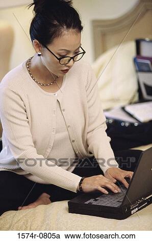 Businesswoman using a laptop View Large Photo Image Stock Image - Businesswoman using a laptop. Fotosearch