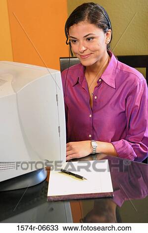 Businesswoman working on a computer View Large Photo Image Stock Image - Businesswoman working on a computer. Fotosearch