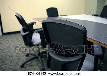Chairs and a table in a boardroom View Large Photo Image Stock Image - Chairs and a table in a boardroom. Fotosearch