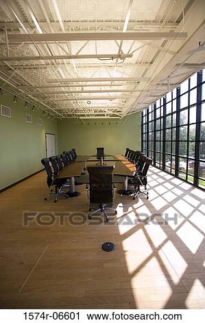 Chairs and a table in a boardroom View Large Photo Image Stock Image - Chairs and a table in a boardroom. Fotosearch