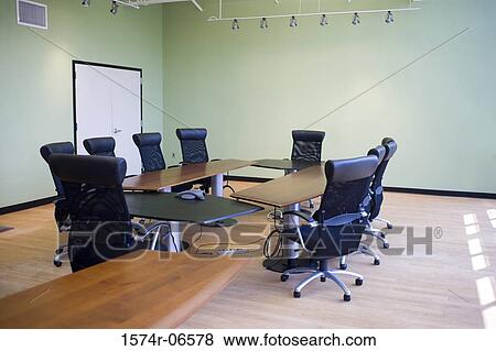 Stock Photo - Chairs and a table in a boardroom. Fotosearch