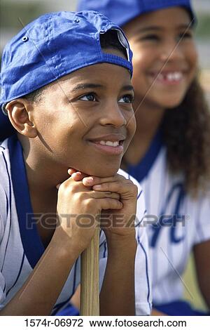 Stock Image - Children watching a baseball game. Fotosearch