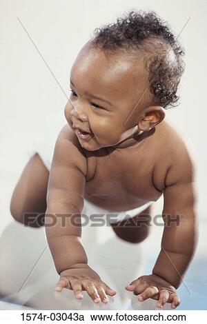 Close-up of a baby boy crawling View Large Photo Image Stock Image - Close-up of a baby boy crawling. Fotosearch