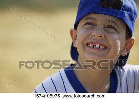 Stock Photography - Close-up of a boy looking up. Fotosearch
