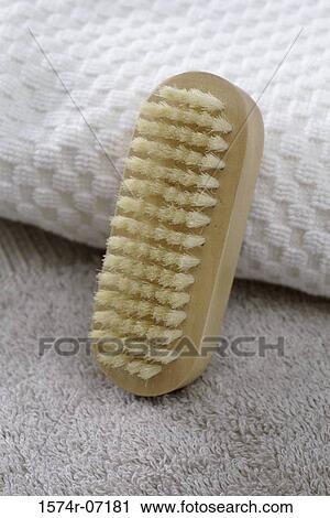 Stock Image - Close-up of a brush against a towel. Fotosearch