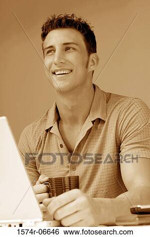 Stock Photograph - Close-up of a businessman smiling. Fotosearch