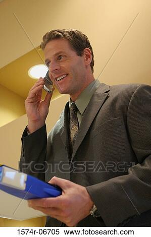 Close-up of a businessman using a mobile phone View Large Photo Image Stock Photography - Close-up of a businessman using a mobile phone. Fotosearch