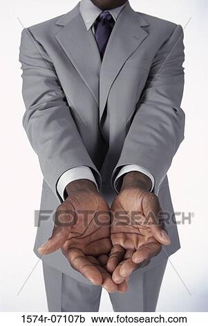 Close-up of a businessman's hands held out View Large Photo Image Stock Image - Close-up of a businessman's hands held out. Fotosearch