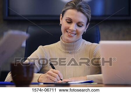 Close-up of a businesswoman sitting in a conference room View Large Photo Image Stock Image - Close-up of a businesswoman sitting in a conference room. Fotosearch