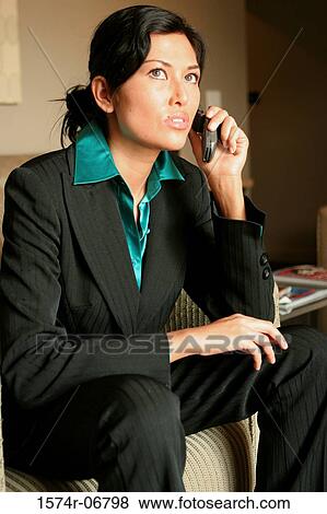 Close-up of a businesswoman using a mobile phone View Large Photo Image Stock Photo - Close-up of a businesswoman using a mobile phone. Fotosearch