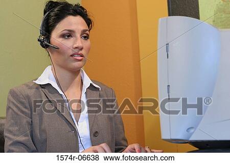 Stock Photo - Close-up of a businesswoman working in an office. Fotosearch