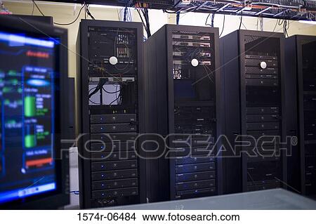 Picture - Close-up of a computer monitor in front of network servers. Fotosearch