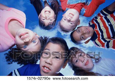 Close-up of a group of children in a huddle View Large Photo Image Stock Image - Close-up of a group of children in a huddle. Fotosearch
