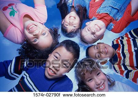 Close-up of a group of children in a huddle View Large Photo Image Stock Image - Close-up of a group of children in a huddle. Fotosearch