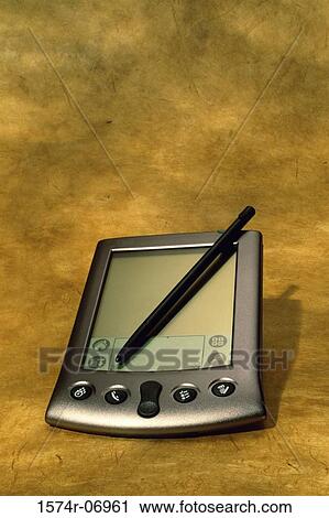 Stock Image - Close-up of a hand held device. Fotosearch